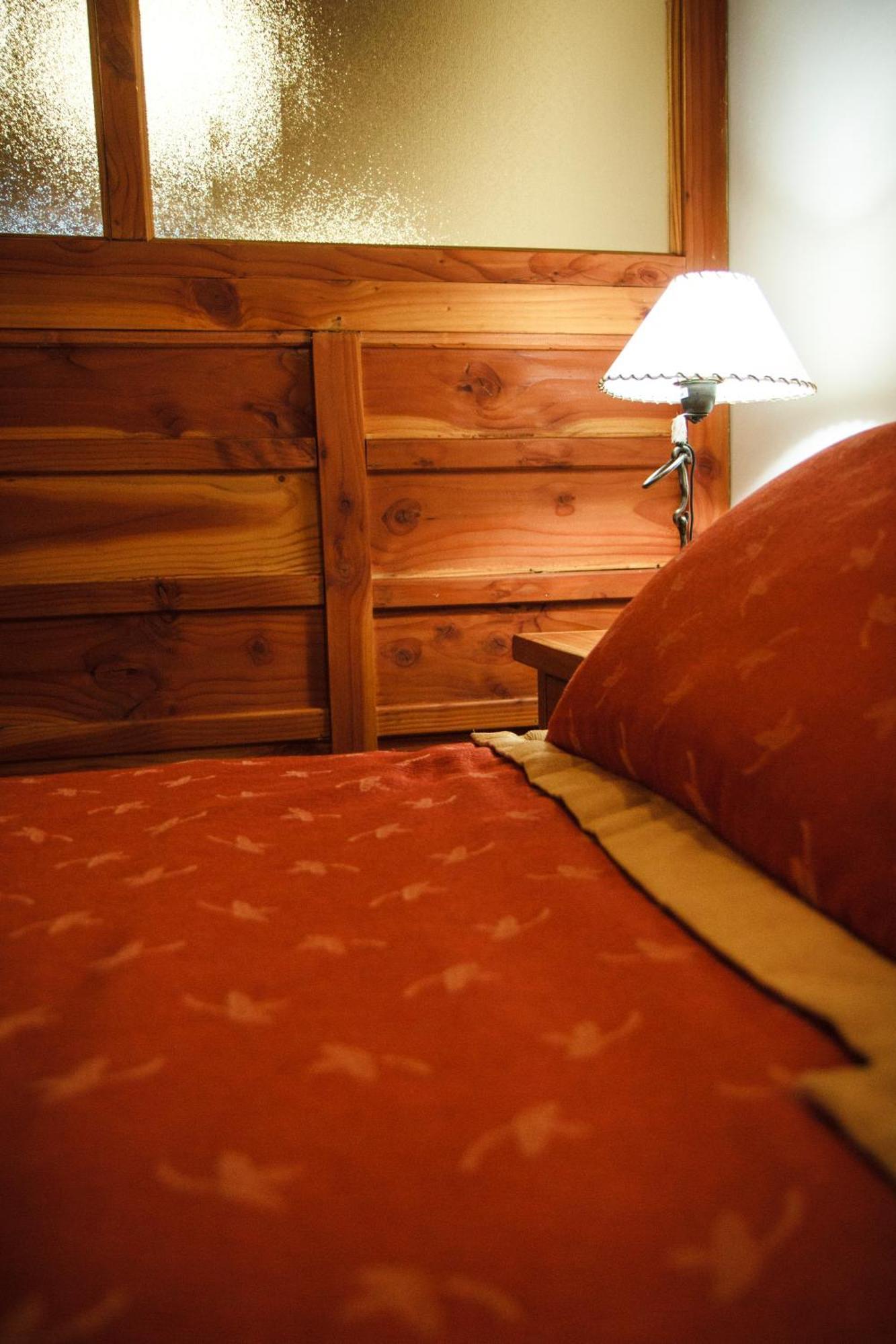 Melewe Aparthotel Villa La Angostura Quarto foto
